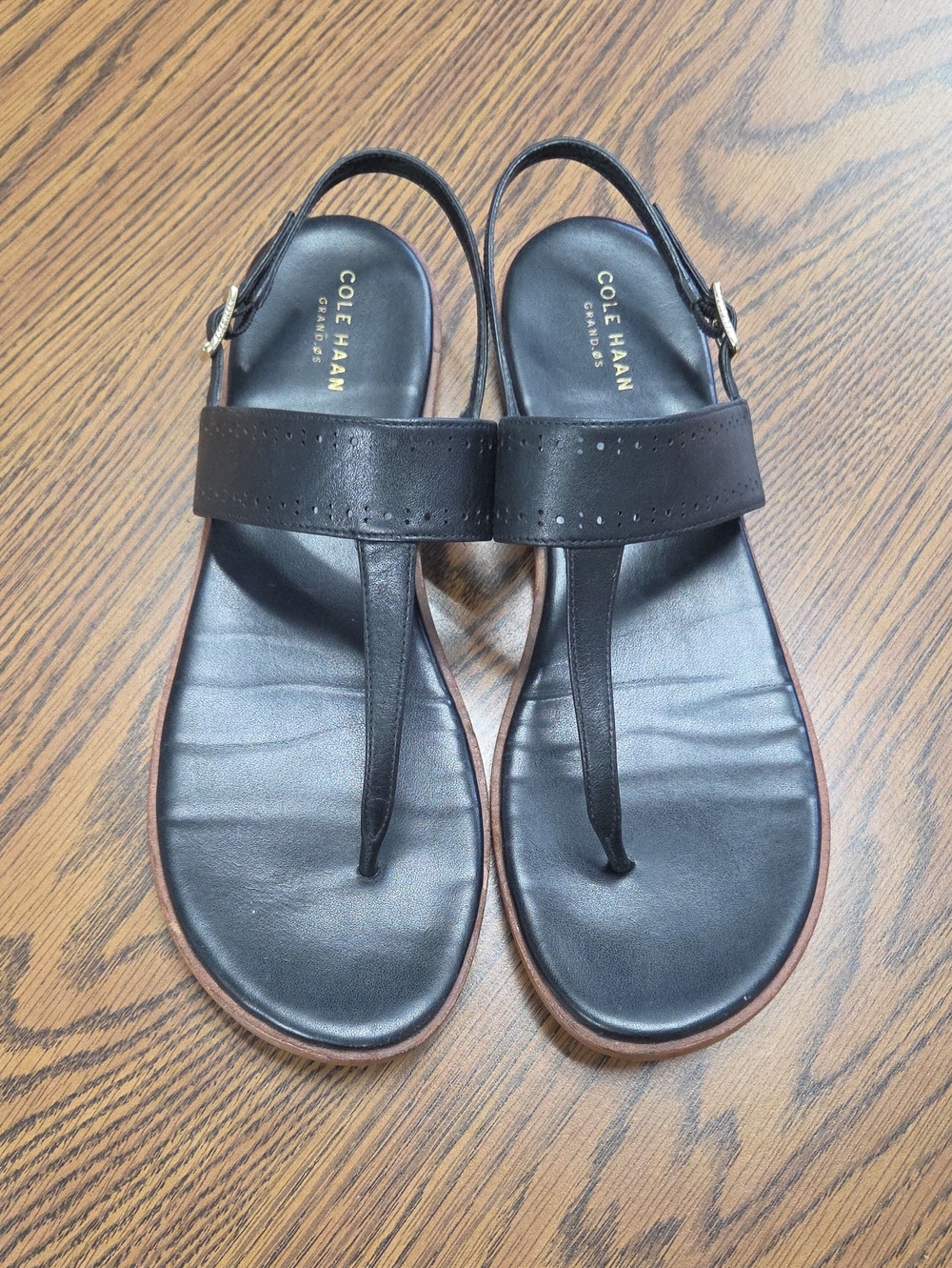 Cole Haan Ainslee Grand Black Leather T-Strap Flat Sandals with Gold Buckle